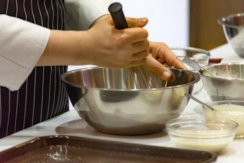 Chef making dough on kitchen, Mixing Butter Milk Pastry Bakery, cook and cake Stock Photos