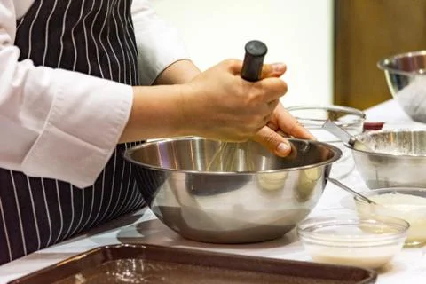 Chef making dough on kitchen, Mixing Butter Milk Pastry Bakery, cook and cake Stock Photos