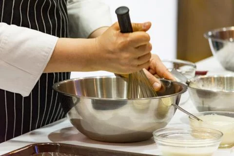 Chef making dough on kitchen, Mixing Butter Milk Pastry Bakery, cook and cake Stock Photos