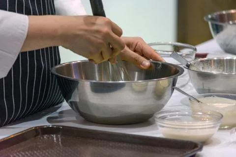 Chef making dough on kitchen, Mixing Butter Milk Pastry Bakery, cook and cake Stock Photos