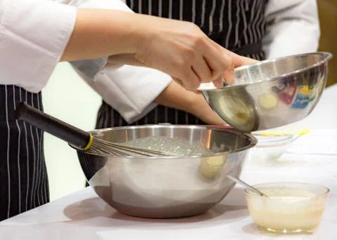 Chef making dough on kitchen, Mixing Butter Milk Pastry Bakery, cook and cake Stock Photos