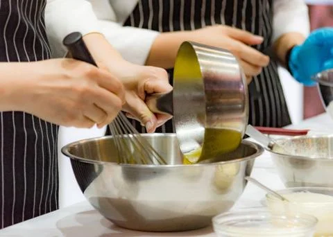 Chef making dough on kitchen, Mixing Butter Milk Pastry Bakery, cook and cake Stock Photos