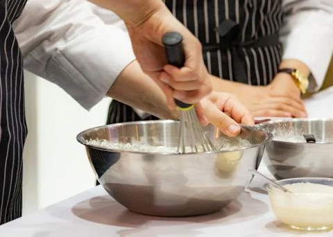 Chef making dough on kitchen, Mixing Butter Milk Pastry Bakery, cook and cake Stock Photos
