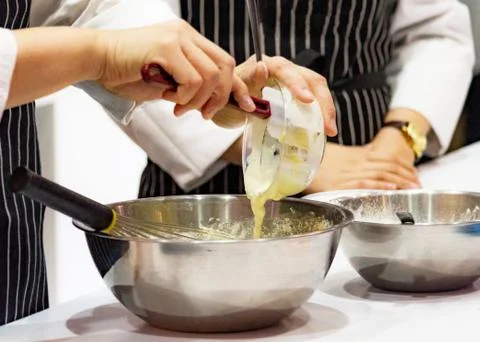 Chef making dough on kitchen, Mixing Butter Milk Pastry Bakery, cook and cake Stock Photos