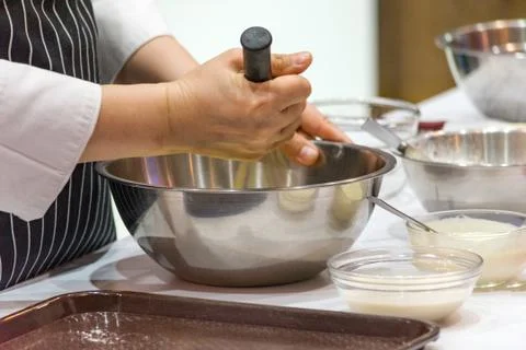 Chef making dough on kitchen, Mixing Butter Milk Pastry Bakery, cook and cake Stock Photos