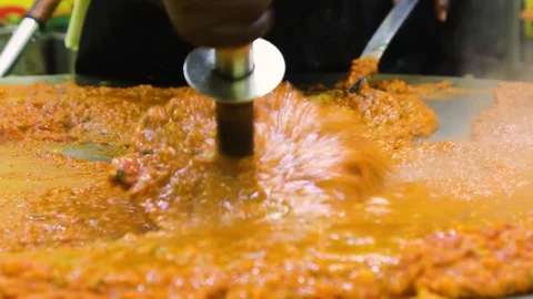 A chef making Famous Indian Fast Food Dish called Pav Bhaji Stock Footage 108251776