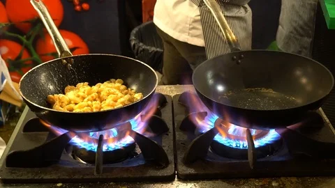 Chef Making Fire On The Frying Pan, Slow Motion Stockbeeldmateriaal 121836964