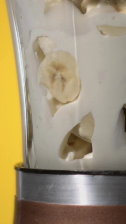 Chef Making Nutritious Smoothies With Banana And Milk In Kitchen Stock Footage 331233334