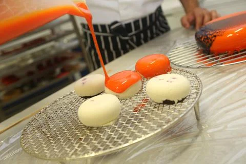 Chef making Orange cake Stock Photos