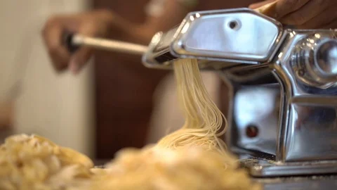 Chef making pasta from hand pasta machine, home cooking style Stock Footage 109496467