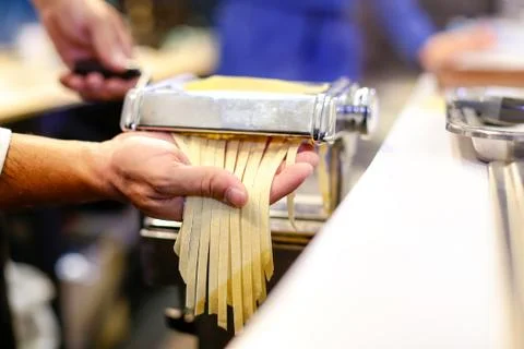 Chef making pasta with a machine, home made  fresh pasta Stock Photos