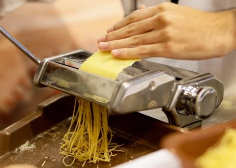 Chef making pasta with a machine, home made  fresh pasta Stock-Fotos