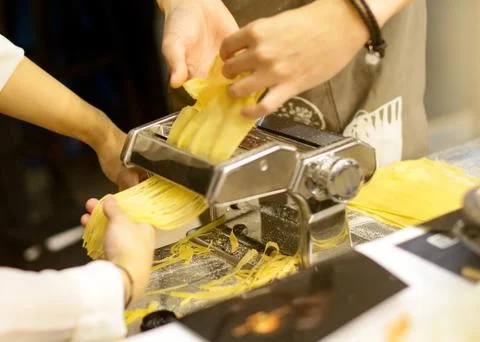 Chef making pasta with a machine, home made  fresh pasta Stock Photos