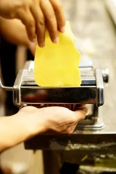 Chef making pasta with a machine, home made  fresh pasta Foto stock