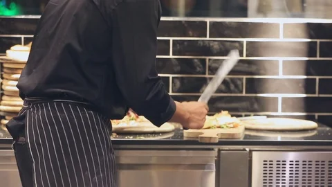 Chef making pizza in hotel kitchen Stock Footage 109613912
