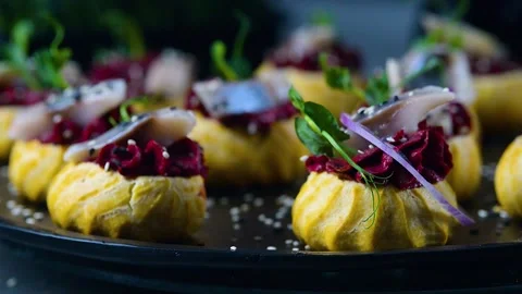 The chef is making profiteroles with herring and beet cream. Stock Footage 277491828