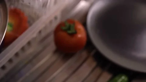 Chef is making salad by cutting tomatoes and cucumbers Stock Footage 180983321