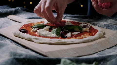 Chef making a salami pizza in the kitchen Stock Footage 132842341