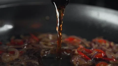 Chef making sauce with beer and vegetables chili pepper Video stock 143778845
