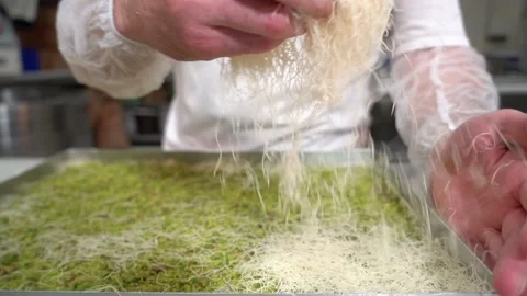 A chef making shredded wheat dessert Stock Footage 150081579
