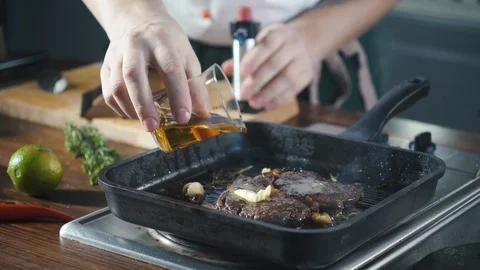 Chef making steak fillet mignon in flambe style on a grill pan. Delicious dish. Stock Footage 124712338