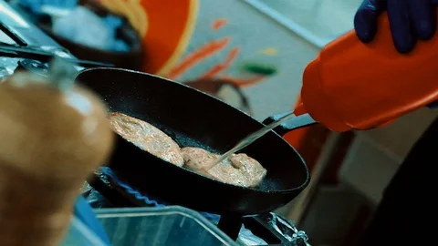 Chef making steak fillet mignon in flambe style on a grill pan. Oil and alcohol Stock Footage 126499380