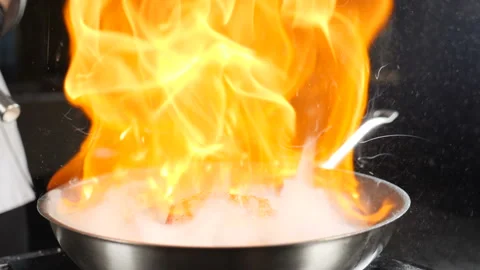 Chef making steak fillet mignon in flambe style on a grill pan. Cooking in Stock Footage 140572012