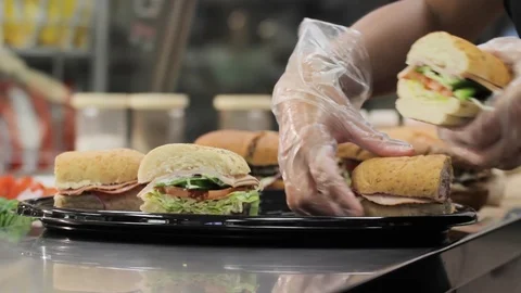 Chef making a sub sandwich platter in the kitchen. Video stock 92874198
