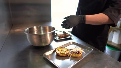 Chef making tasty burger. Cheeseburger with beef patty, cheese, tomato, onion. Stock Footage 261530129