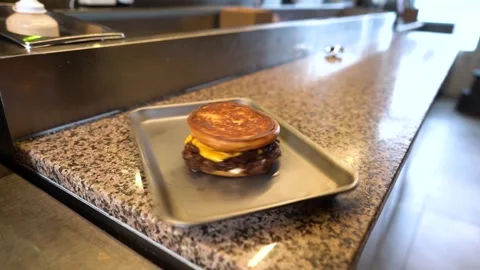 Chef making tasty burger. Cheeseburger with beef patty, cheese, tomato, onion. Stock Footage 262449623