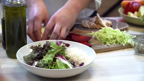 Chef making tasty fresh slad on the kitchen closeup Stock Footage 77037892