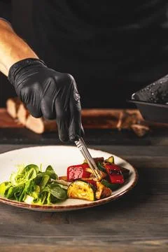 Chef making vegetarian dish Stock Photos