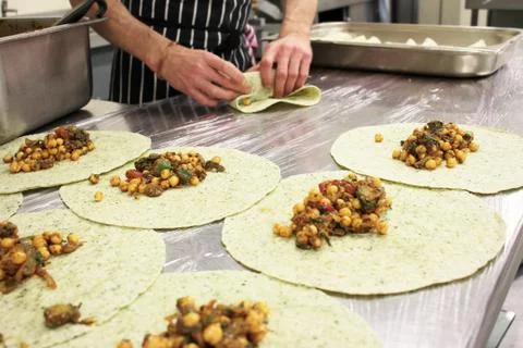 Chef making wraps Stock Photos