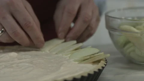 Chef Man Baker Putting Apple Pieces on Creamy Pie Stock Footage 160963063