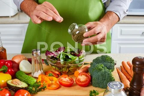 Chef man cooking in the kitchen. Stock Photos