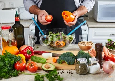 Chef man cooking in the kitchen. Stock Photos