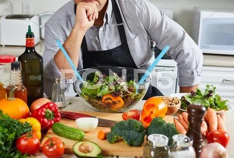 Chef man cooking in the kitchen. Stock Photos