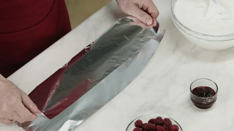 Chef Man Cut Foil and Fold on Kitchen Counter Stock Footage 164018814