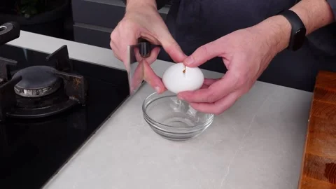 Chef man hands cooking Omelette, break eggs into a bowl Video stock 260233606