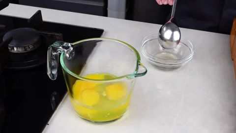 Chef man hands cooking Omelette and whisking eggs with sauce Stock Footage 260233653