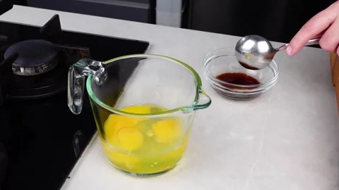 Chef man hands cooking Omelette and whisking eggs with sauce Stock Footage 260233717