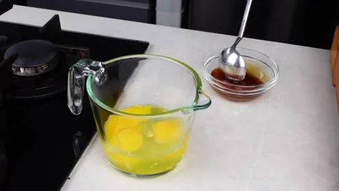 Chef man hands cooking Omelette and whisking eggs with sauce Stock Footage 260234024