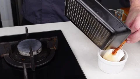 Chef man hands cooking Omelette, pouring oil and sauce into pan Stock Footage 260234560