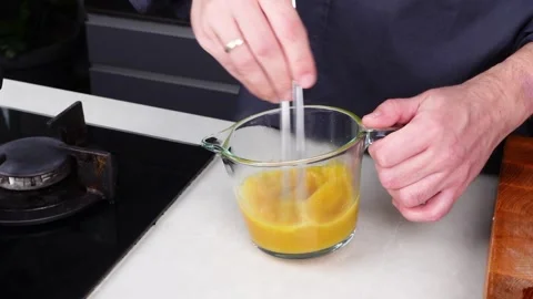 Chef man hands cooking Omelette and whisking eggs with sauce Stock Footage 260234579