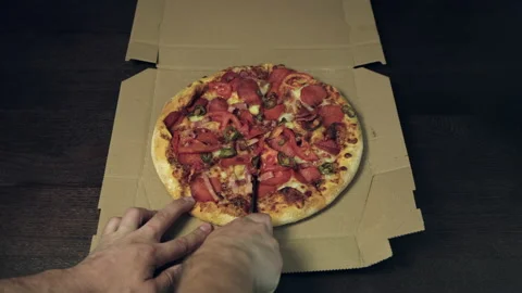 Chef. Man hands is slicing a pizza take piece and eat Stock-Footage 198179652