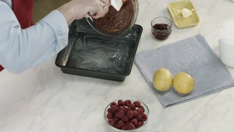 Chef Man Putting Chocolate Dough in Baking Plate Stock Footage 164020229