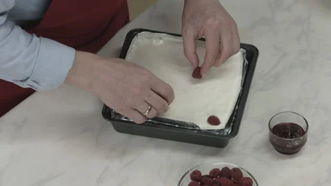 Chef Man Putting Strawberries on Cake Creamy Top Stock Footage 164020330
