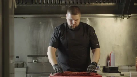 The chef marinates raw pork ribs before grilling. Stock Footage 235338392