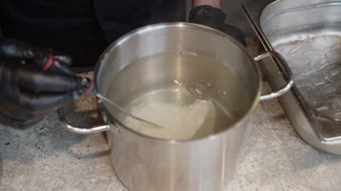 Chef Measuring Temperature in Cooking Pot Stock Footage 301529855