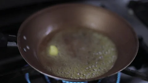 Chef Melting Butter and Adding Potato Puree on Pan Stock Footage 129335164